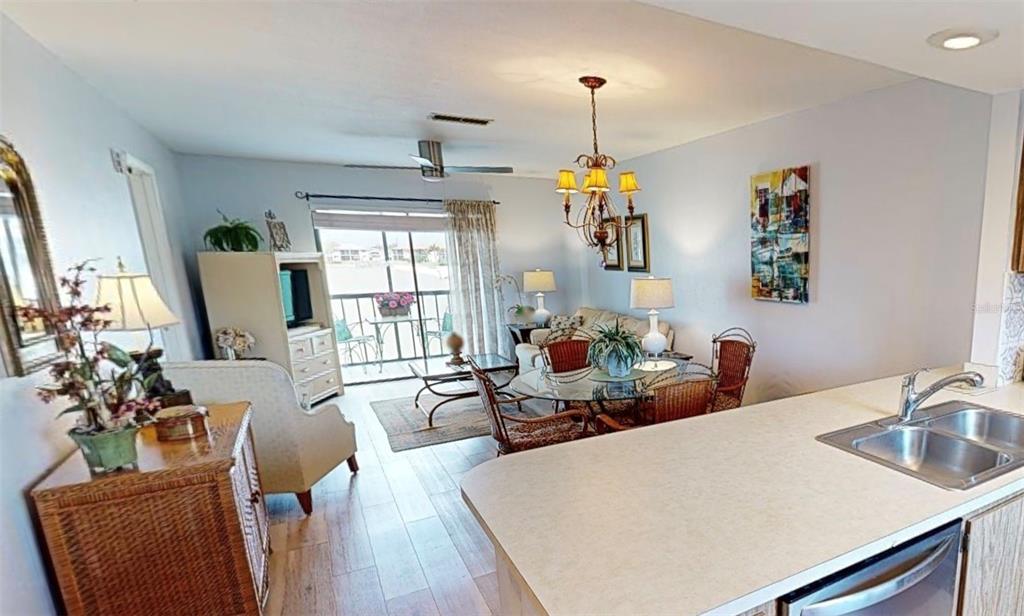 25225 Rampart Boulevard, Unit 105 Punta Gorda, FL 33983 - Photo 14 of 40 a living room with furniture and a window