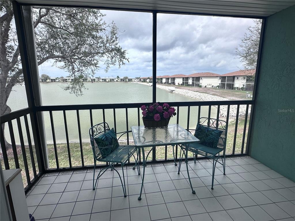 25225 Rampart Boulevard, Unit 105 Punta Gorda, FL 33983 - Photo 24 of 40 a view of a chairs and table in patio