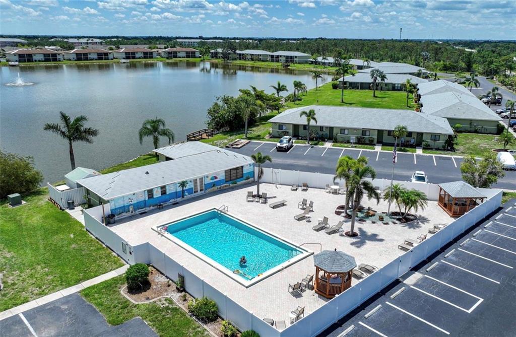 25225 Rampart Boulevard, Unit 105 Punta Gorda, FL 33983 - Photo 30 of 40 an aerial view of a house with garden space and outdoor seating