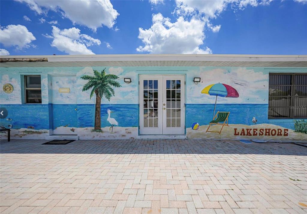 25225 Rampart Boulevard, Unit 105 Punta Gorda, FL 33983 - Photo 33 of 40 a front view of a building with retail shops