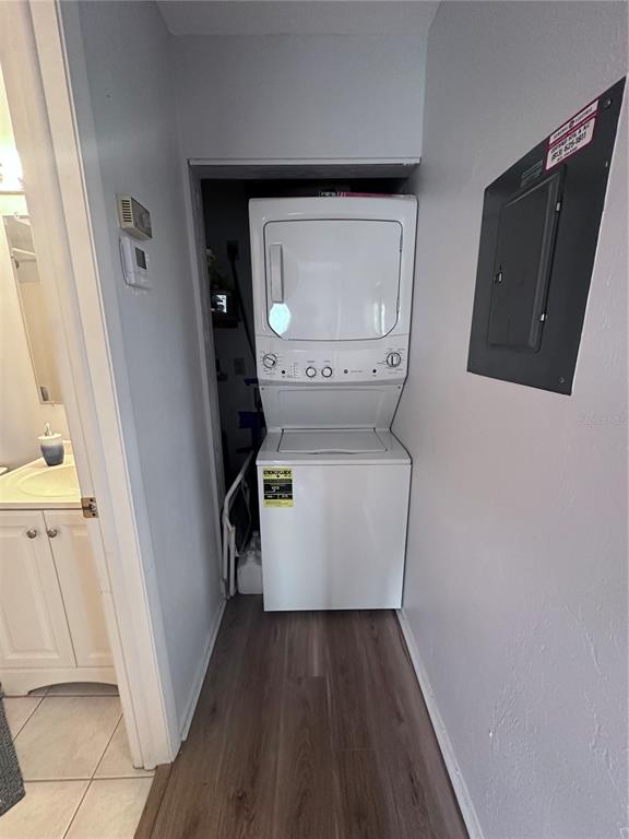 25225 Rampart Boulevard, Unit 105 Punta Gorda, FL 33983 - Photo 37 of 40 a utility room with wooden floor washer and dryer