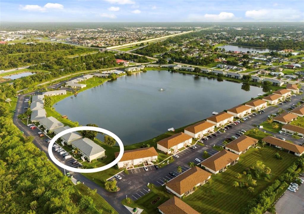 25225 Rampart Boulevard, Unit 105 Punta Gorda, FL 33983 - Photo 6 of 40 an aerial view of lake residential house with outdoor space