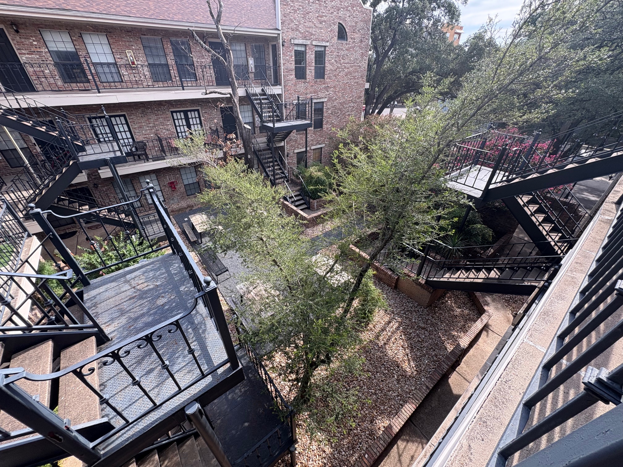 2801 Rio Grande Street, Unit 303 Austin, TX 78705 - Photo 3 of 11 View of community featuring stairway and a balcony