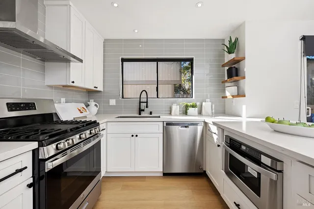 a kitchen with a stove and a sink