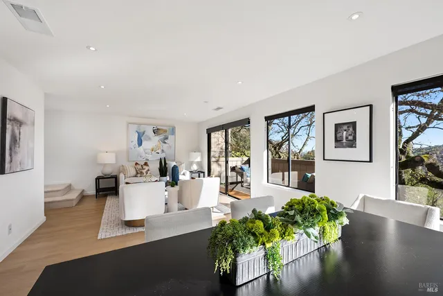 a view of a living room and dining room