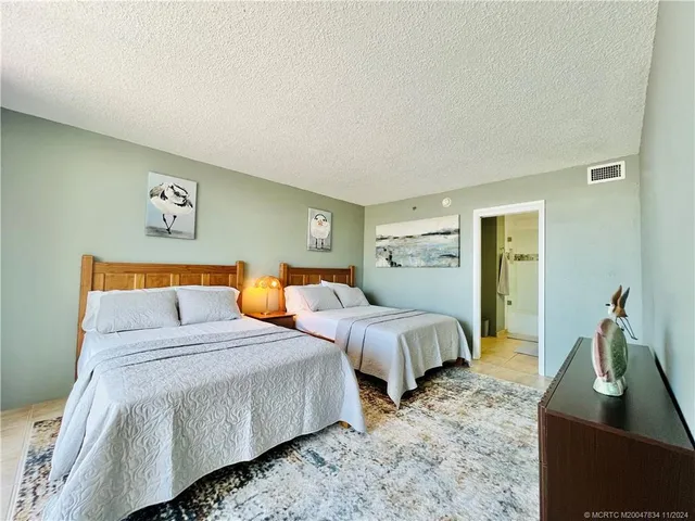 a bedroom with bed and window