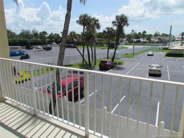 a view of a wooden bridge from a balcony