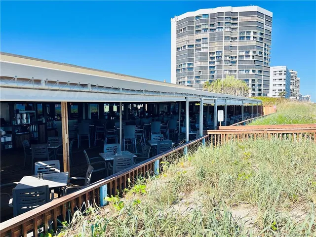 a group of people sitting at tables in a room