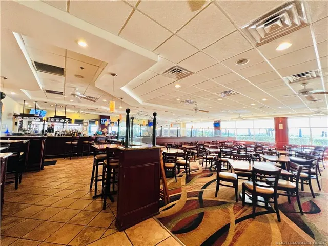 a view of a chairs and table on the wooden floor