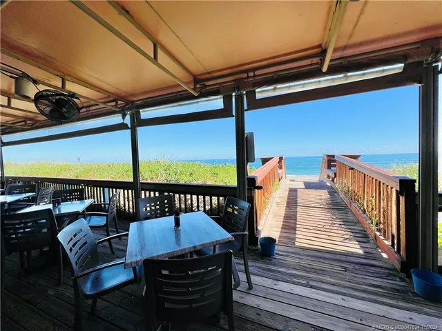 a view of a balcony with chairs