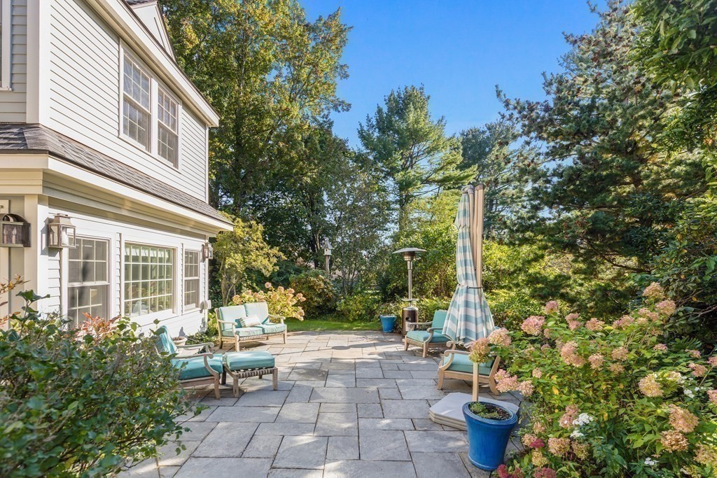 173 Holt Road Andover, MA 01810 - Photo 28 of 33 a view of a patio with chairs and potted plants