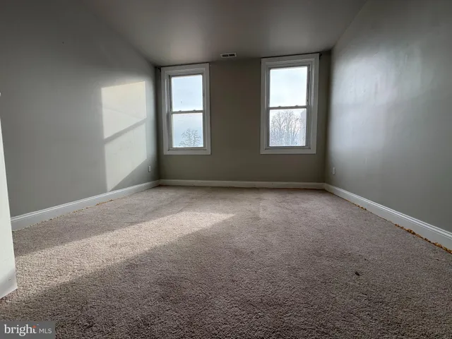 an empty room with windows