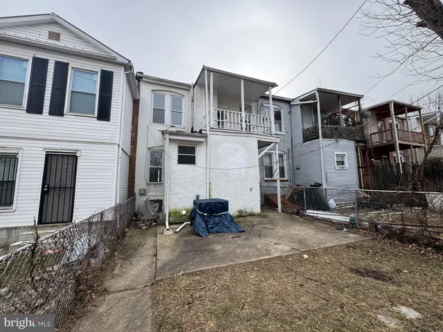 a front view of a house with parking