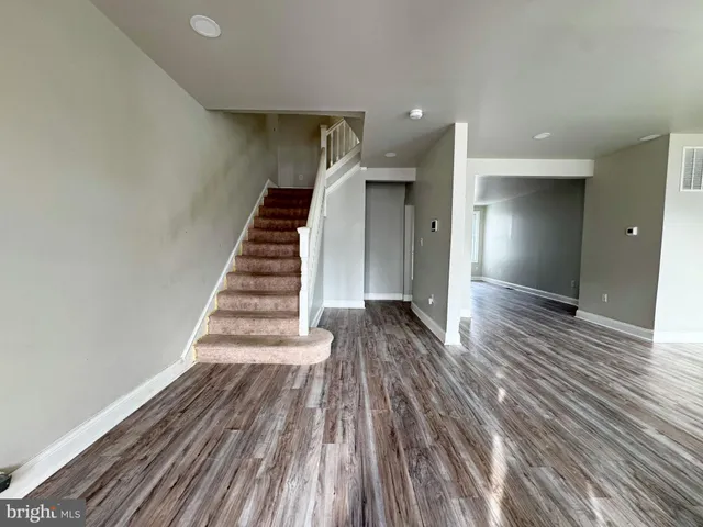a view of entryway with wooden floor