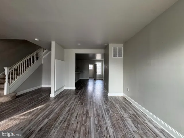 a view of gallery with wooden floor