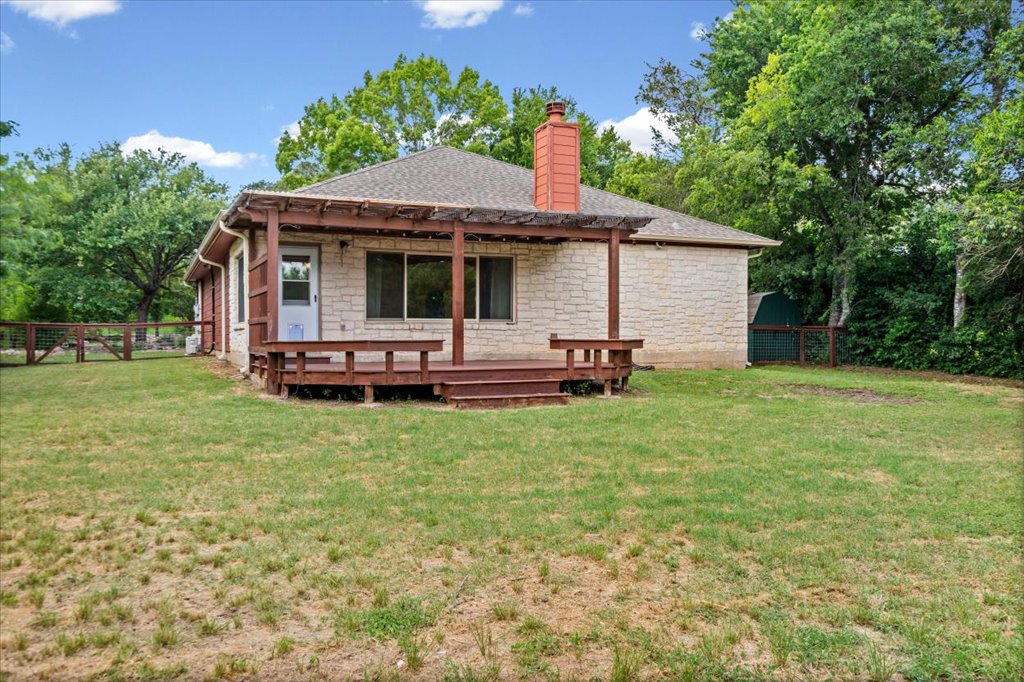 37 Pillow Road Austin, TX 78745 - Photo 18 of 18 A quaint stone-faced home with a welcoming wooden deck and pergola.
