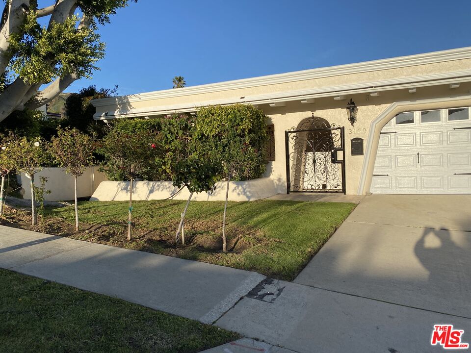 3900 Castlerock Road Malibu, CA 90265 - Photo 2 of 52 a view of a house with a yard