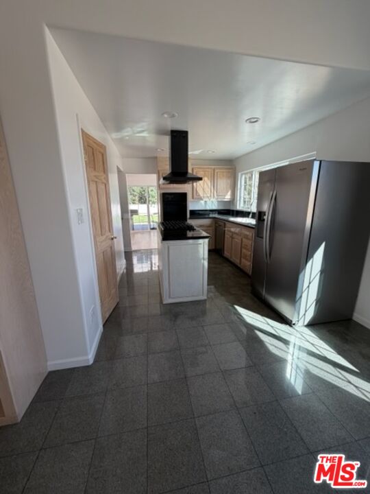 3900 Castlerock Road Malibu, CA 90265 - Photo 27 of 52 a kitchen with a refrigerator and a sink