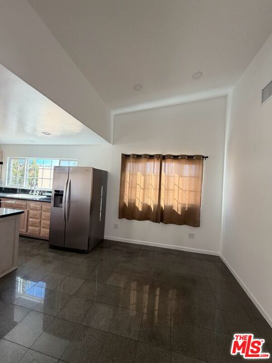 3900 Castlerock Road Malibu, CA 90265 - Photo 28 of 52 a view of an empty room with kitchen and window