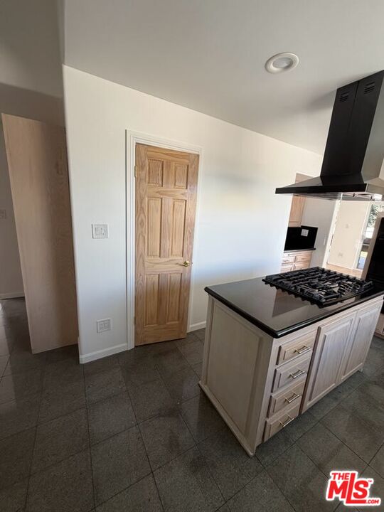 3900 Castlerock Road Malibu, CA 90265 - Photo 30 of 52 a kitchen with stainless steel appliances granite countertop a stove and a refrigerator