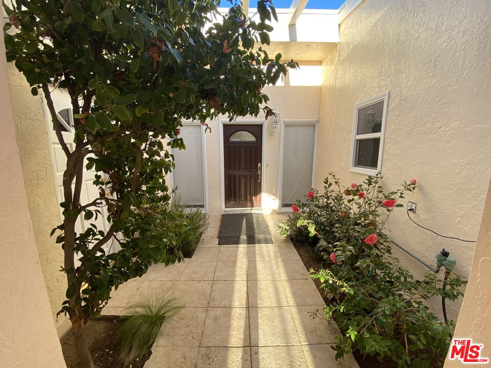3900 Castlerock Road Malibu, CA 90265 - Photo 3 of 52 a front view of a house with a yard