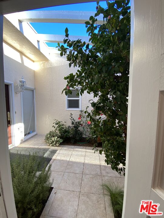 3900 Castlerock Road Malibu, CA 90265 - Photo 4 of 52 a view of a house with potted plants