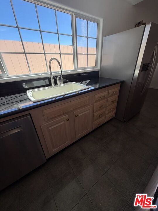 3900 Castlerock Road Malibu, CA 90265 - Photo 41 of 52 a kitchen with granite countertop cabinets and sink