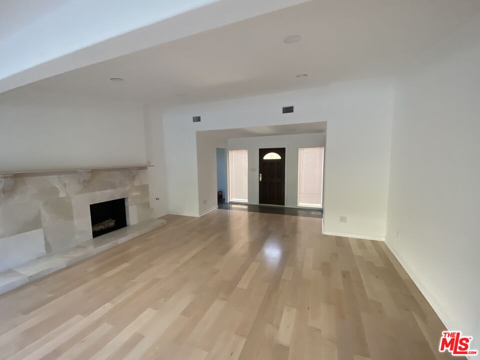 3900 Castlerock Road Malibu, CA 90265 - Photo 6 of 52 a view of empty room with a fireplace