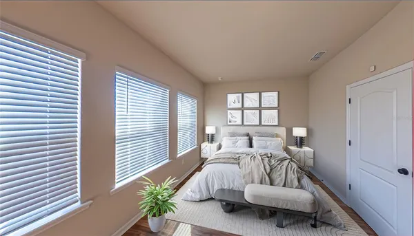 a view of a room with wooden floor and a window