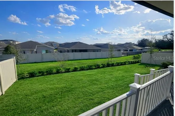 a view of a lake with a big yard