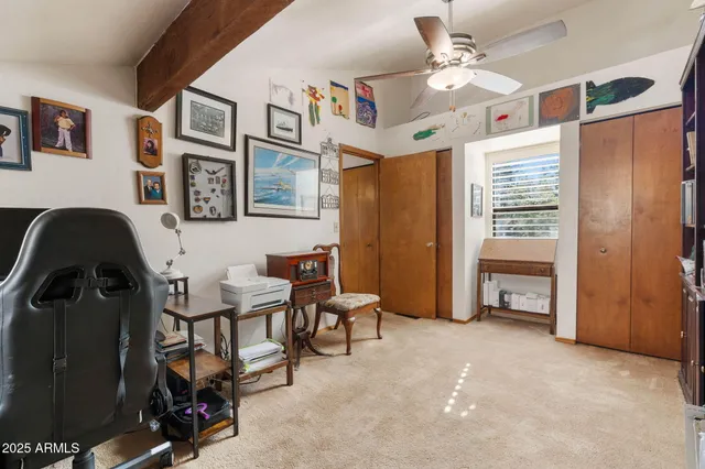 a view of a workspace with furniture and toys