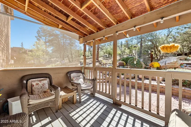 a view of a chairs and table in the balcony