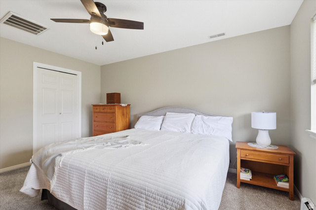 45 West 100 South Mendon, UT 84325 - Photo 25 of 64 Carpeted bedroom featuring a closet and a ceiling fan