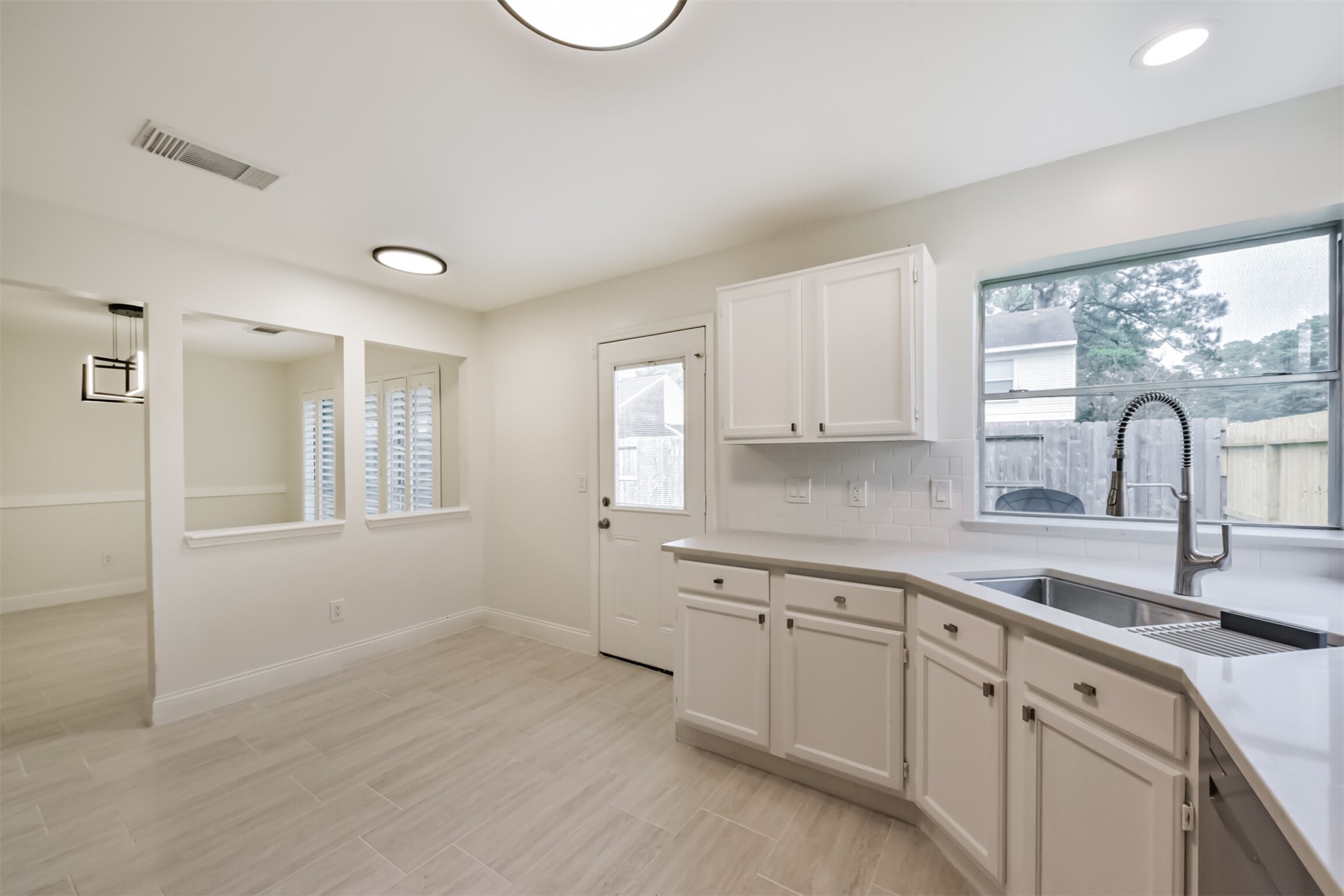 9202 Bayou Bluff Drive Spring, TX 77379 - Photo 15 of 33 a kitchen with a sink cabinets and window