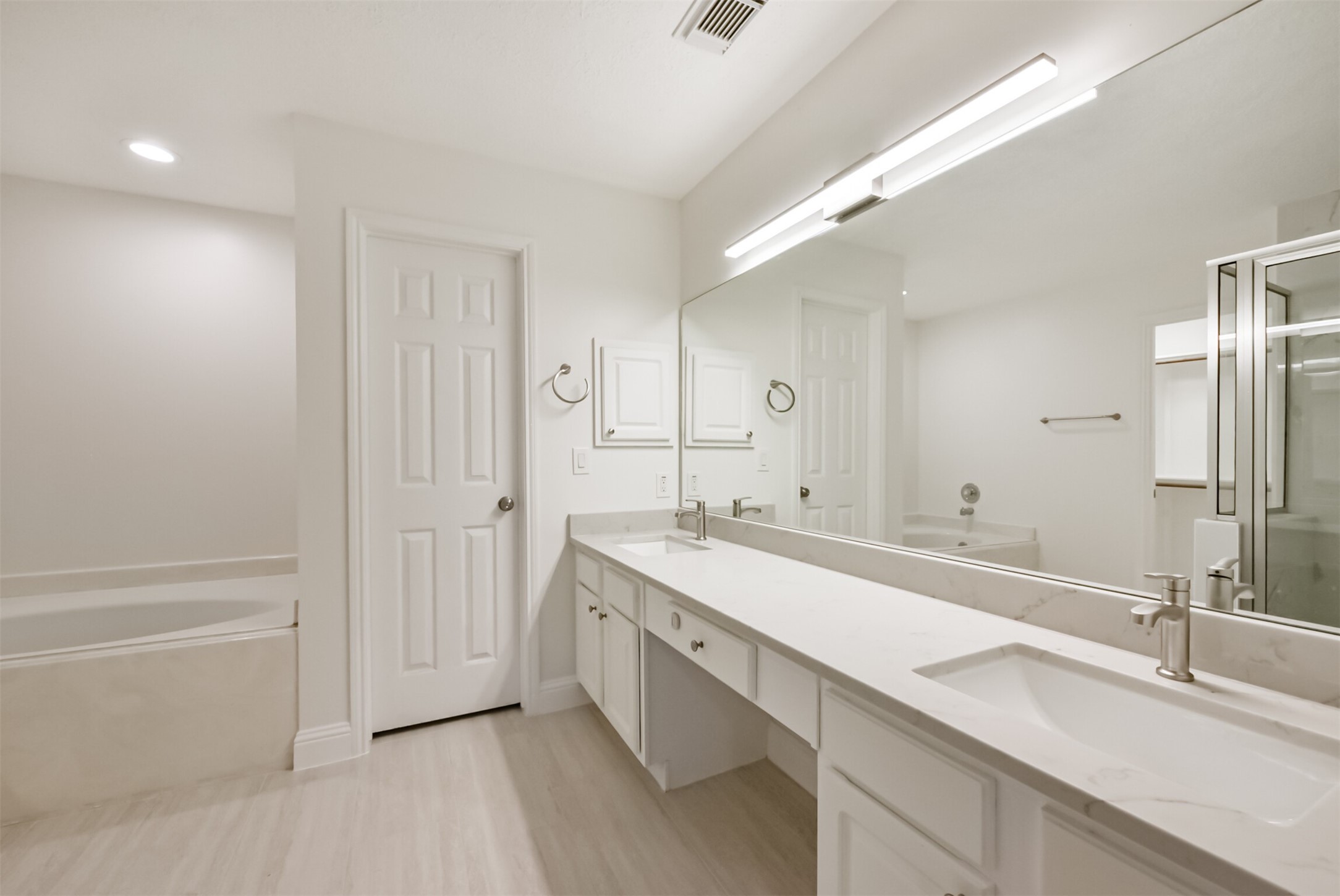 9202 Bayou Bluff Drive Spring, TX 77379 - Photo 18 of 33 a spacious bathroom with a double vanity sink and mirror