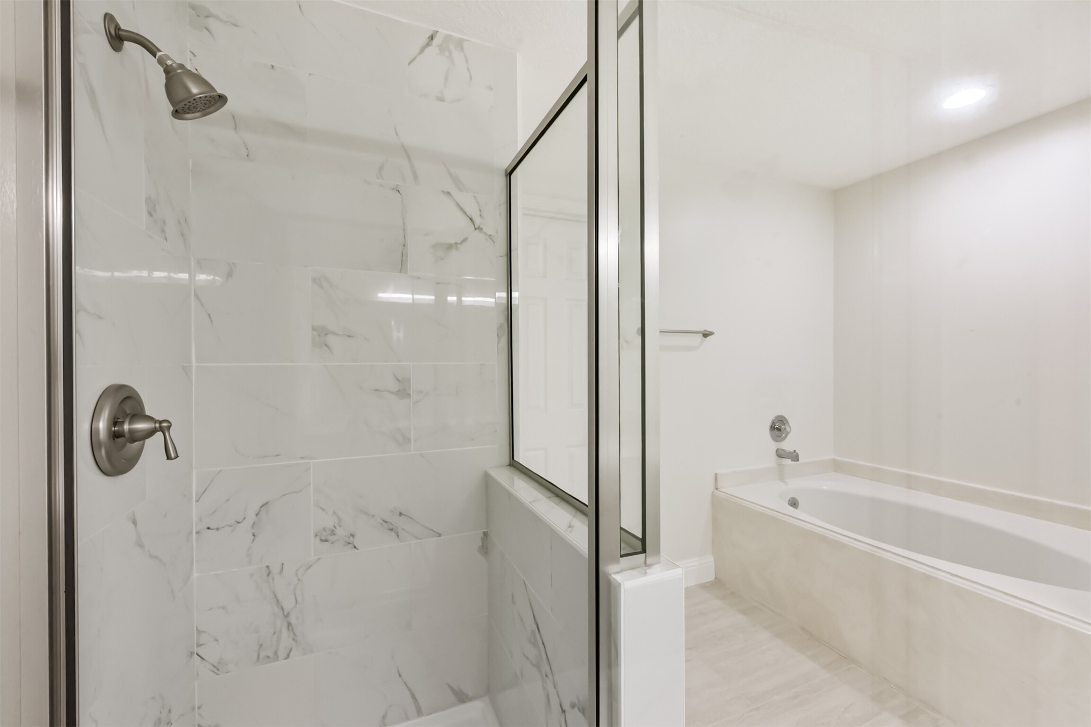 9202 Bayou Bluff Drive Spring, TX 77379 - Photo 21 of 33 a bathroom with a bathtub and a shower