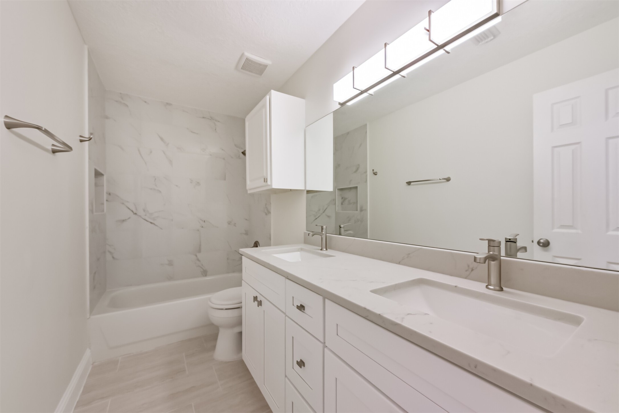 9202 Bayou Bluff Drive Spring, TX 77379 - Photo 24 of 33 a bathroom with a sink a toilet and shower