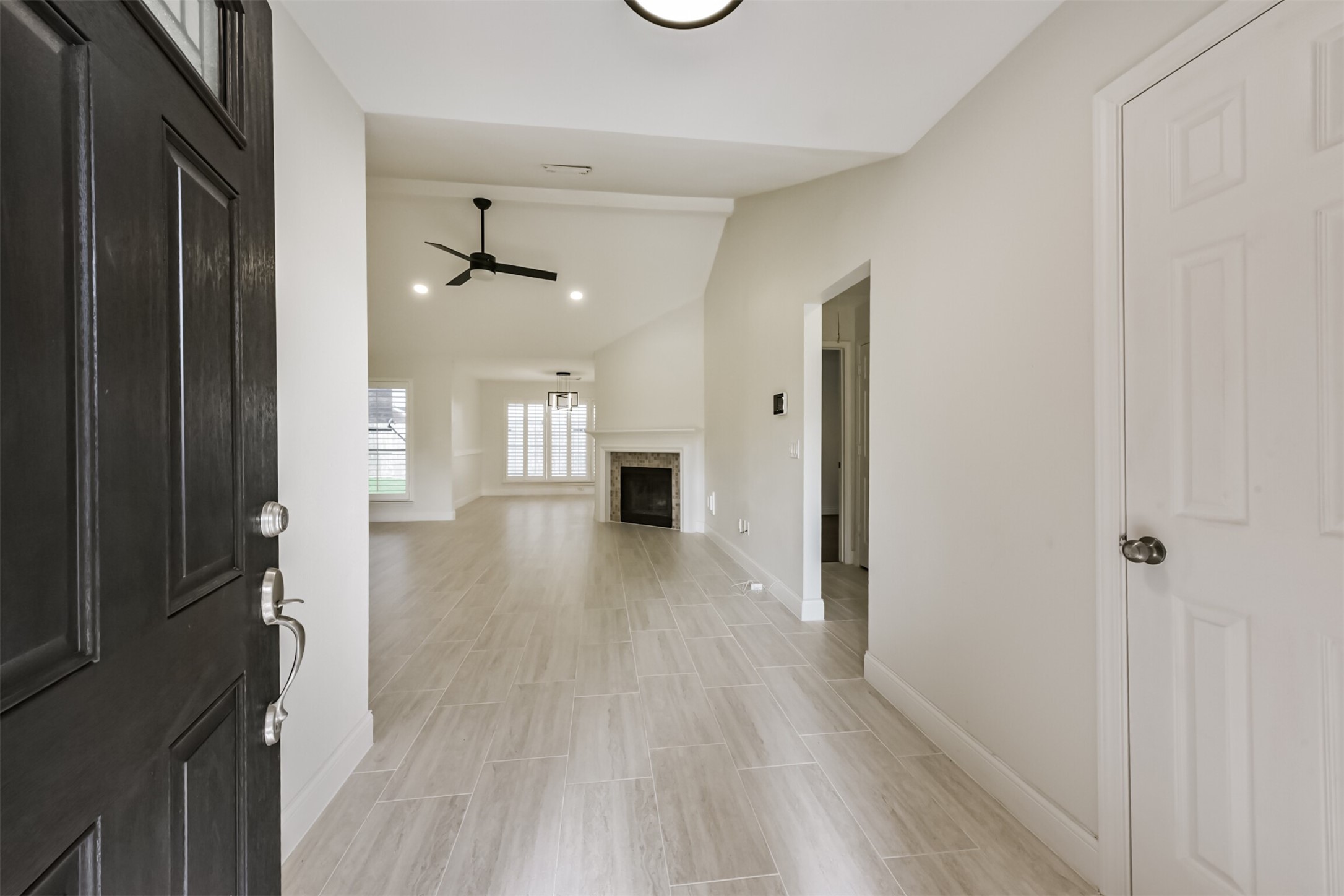 9202 Bayou Bluff Drive Spring, TX 77379 - Photo 5 of 33 a view of a hallway with wooden floor and a living room