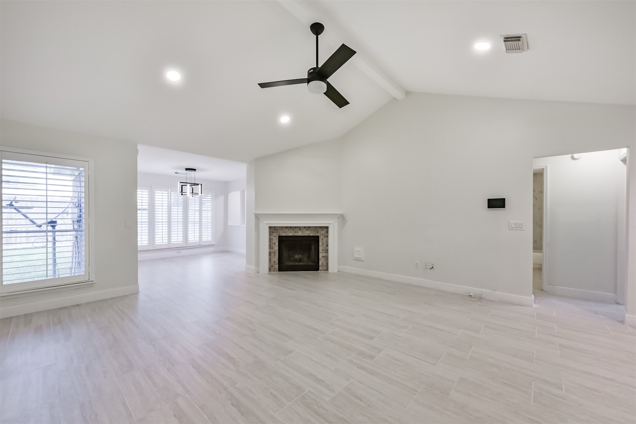 9202 Bayou Bluff Drive Spring, TX 77379 - Photo 7 of 33 wooden floor in an empty room with a window