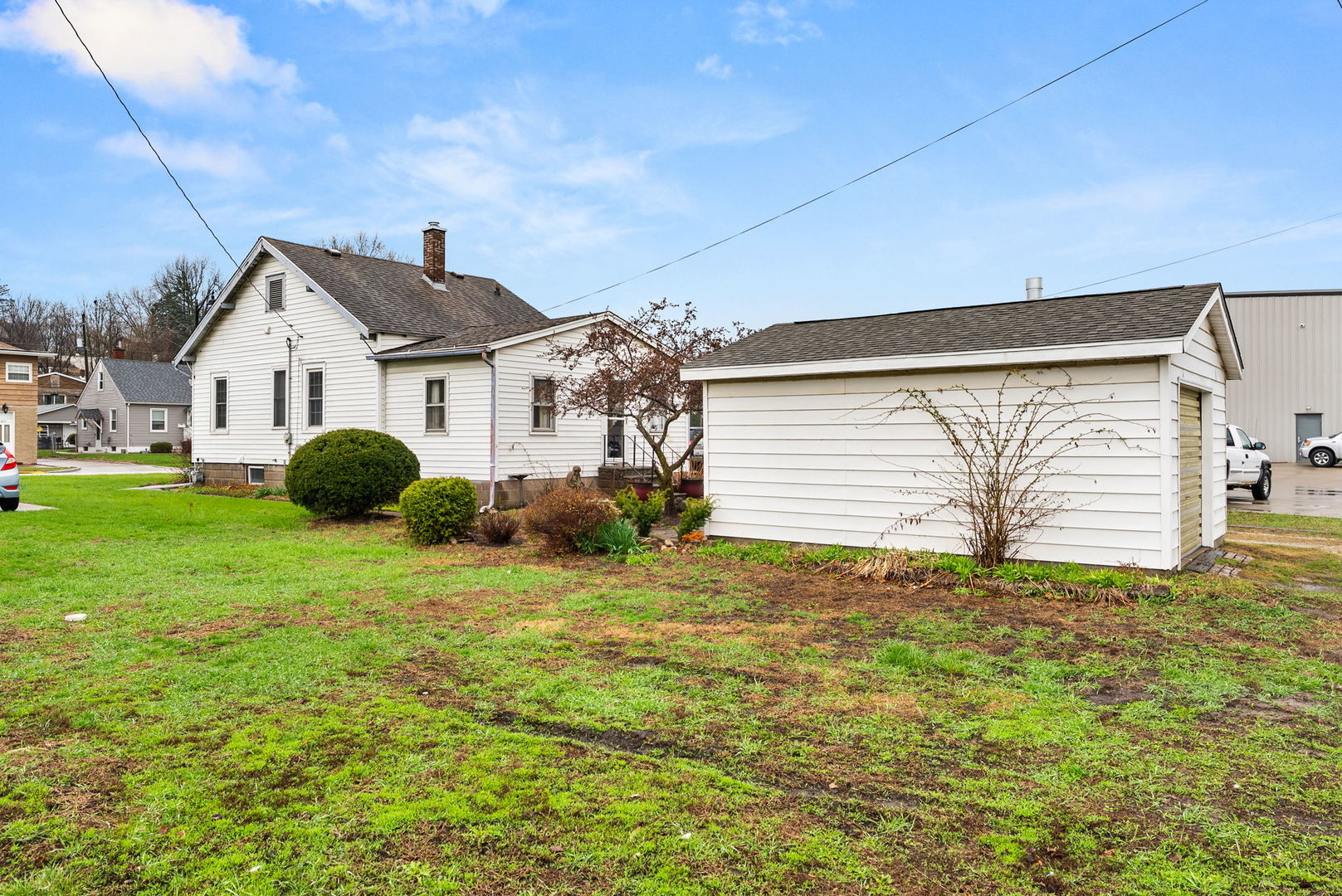313 1st Avenue Silvis, IL 61282 - Photo 6 of 23 a front view of a house with a yard and garage