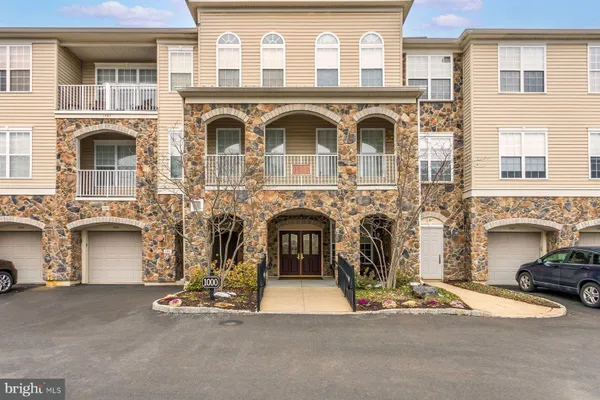 a front view of a house with parking