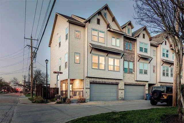 a view of a white building among the street