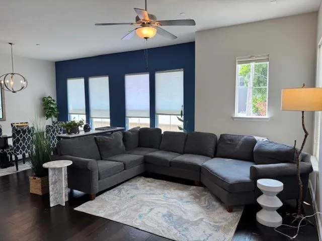 a living room with furniture and a large window