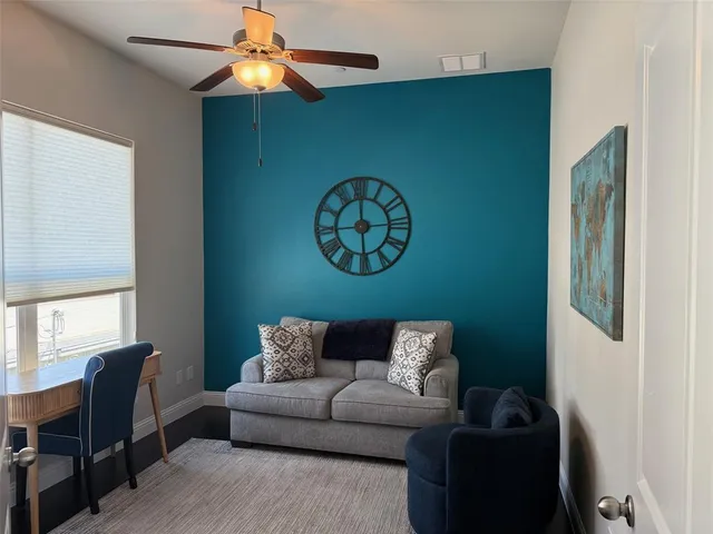 a living room with furniture and a window