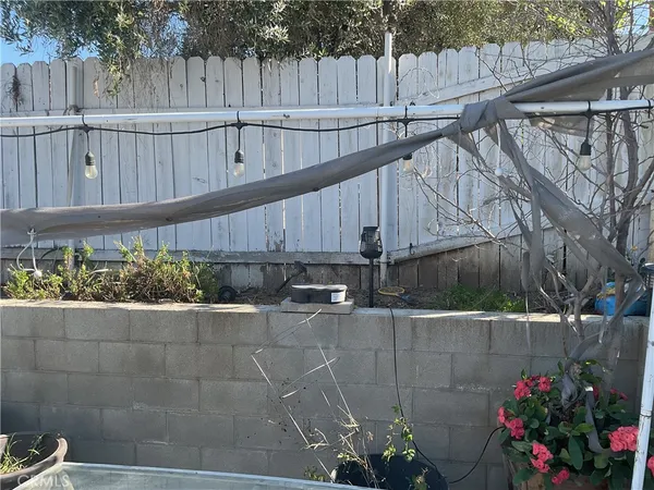 a view of a house with a flower garden