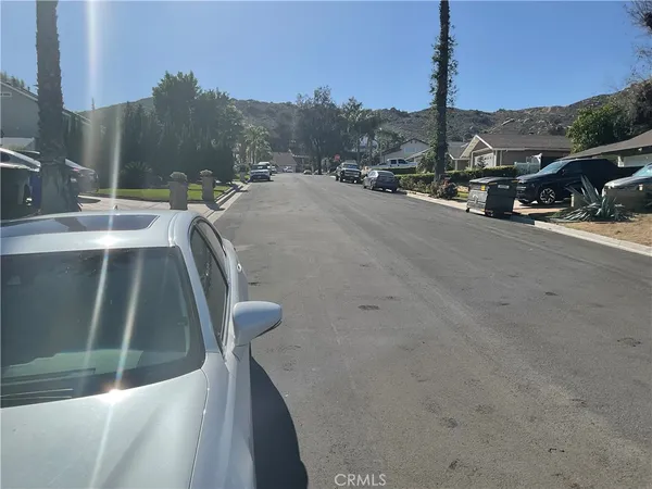 a view of a street with cars