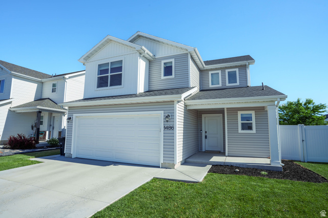 1486 West 2055th Street South Logan, UT 84339 - Photo 2 of 45 Two-story residential exterior featuring light gray horizontal siding and white trim