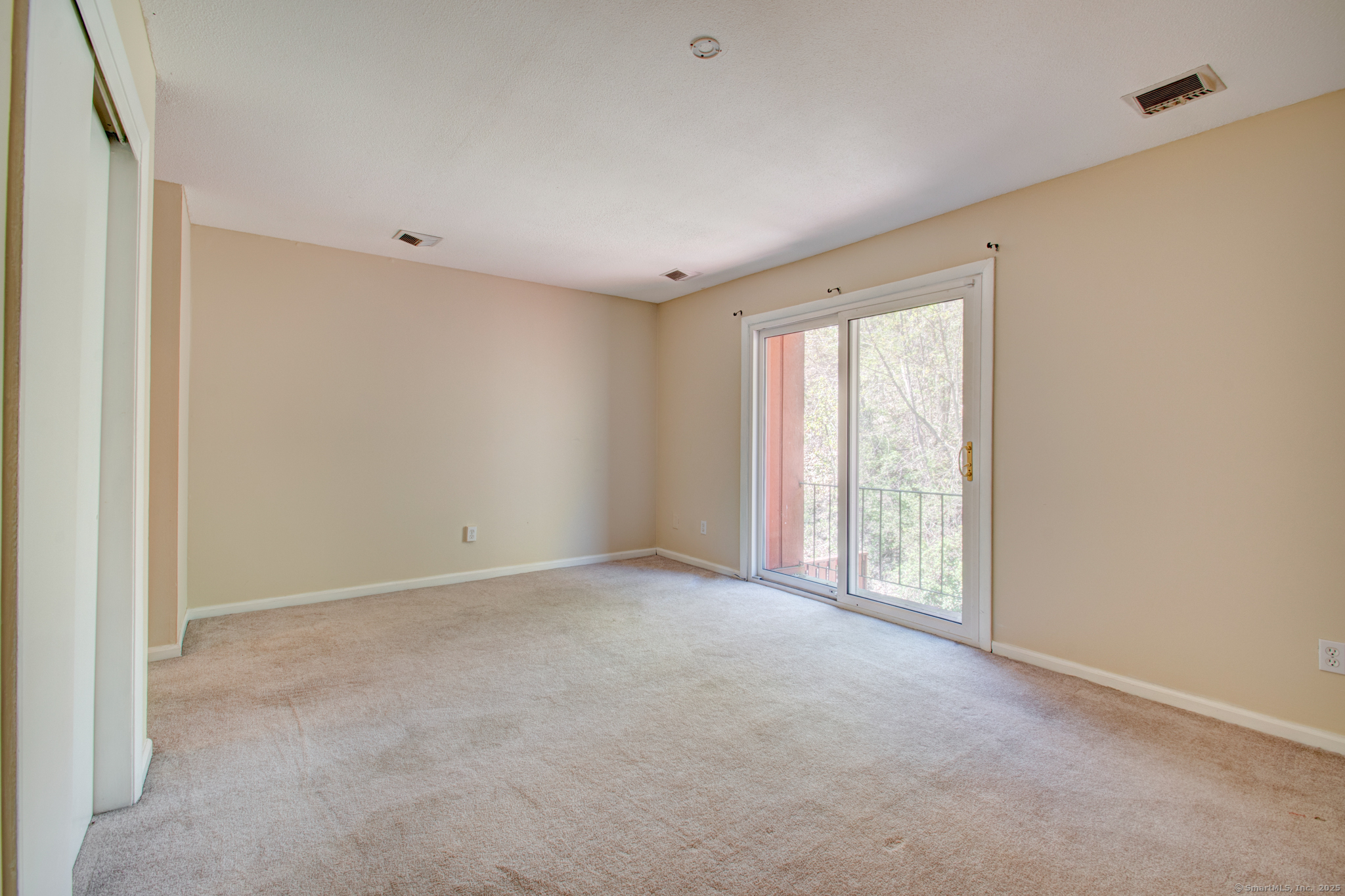 184 Gravel Street, Unit 26 Meriden, CT 06450 - Photo 19 of 27 a view of an empty room with a window