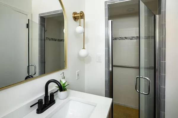 a bathroom with a sink and mirror