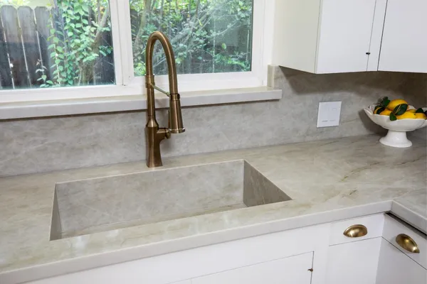 a kitchen with a sink and a window